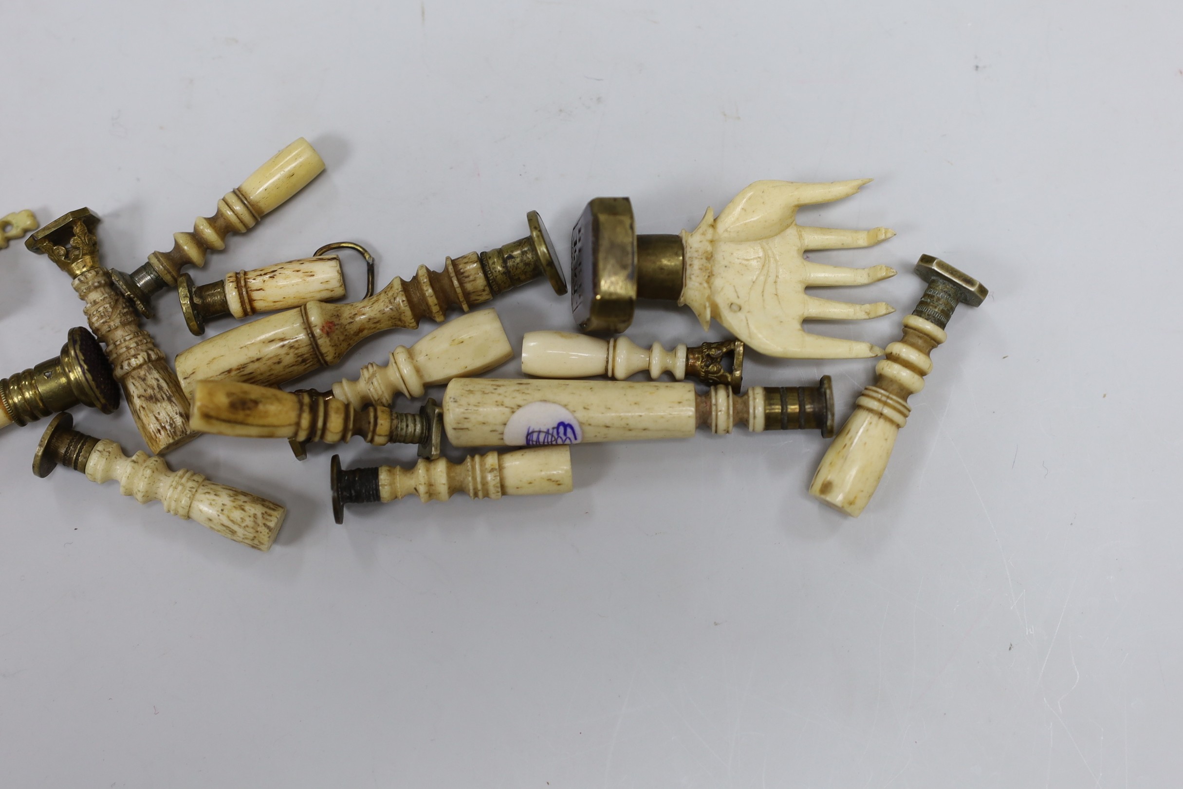 A group of approximately seventeen bone handled desk seals, 19th century and later